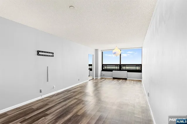 a view of a livingroom with couch and window