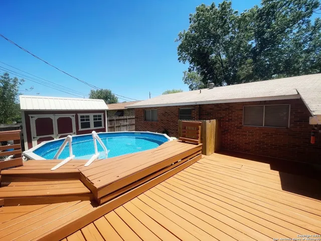 swimming pool with wooden fence