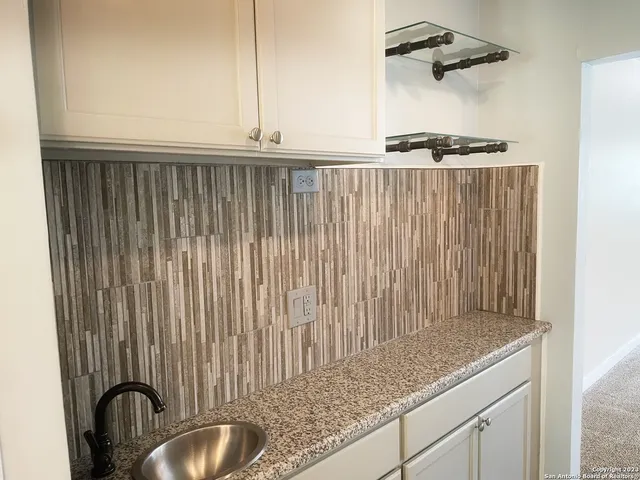a view of a kitchen with a sink