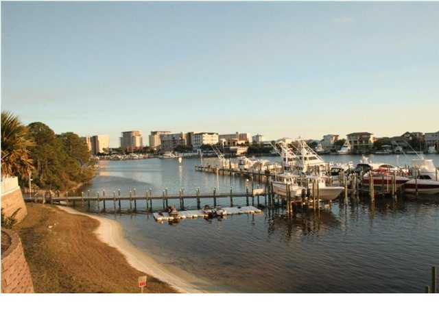 654 Harbor Boulevard, Unit 2 Destin, FL 32541 - Photo 12 of 14 a view of a swimming pool and chairs