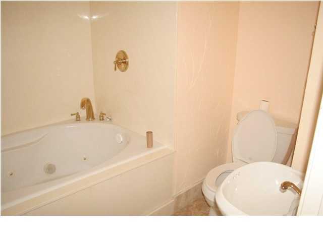 654 Harbor Boulevard, Unit 2 Destin, FL 32541 - Photo 7 of 14 a bathroom with a sink and a bathtub