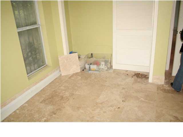 654 Harbor Boulevard, Unit 2 Destin, FL 32541 - Photo 8 of 14 a living room with furniture and a yard