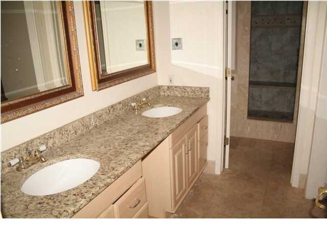 654 Harbor Boulevard, Unit 2 Destin, FL 32541 - Photo 9 of 14 a bathroom with a sink and a mirror