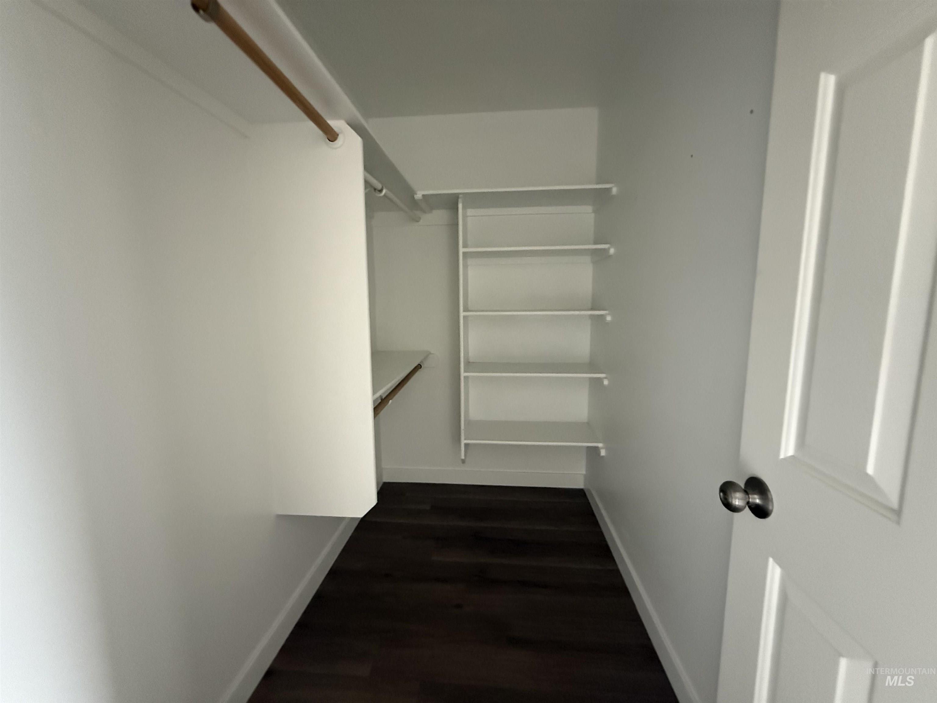538 Morning Sun Drive Nampa, ID 83686 - Photo 17 of 28 Walk in closet featuring dark wood-type flooring
