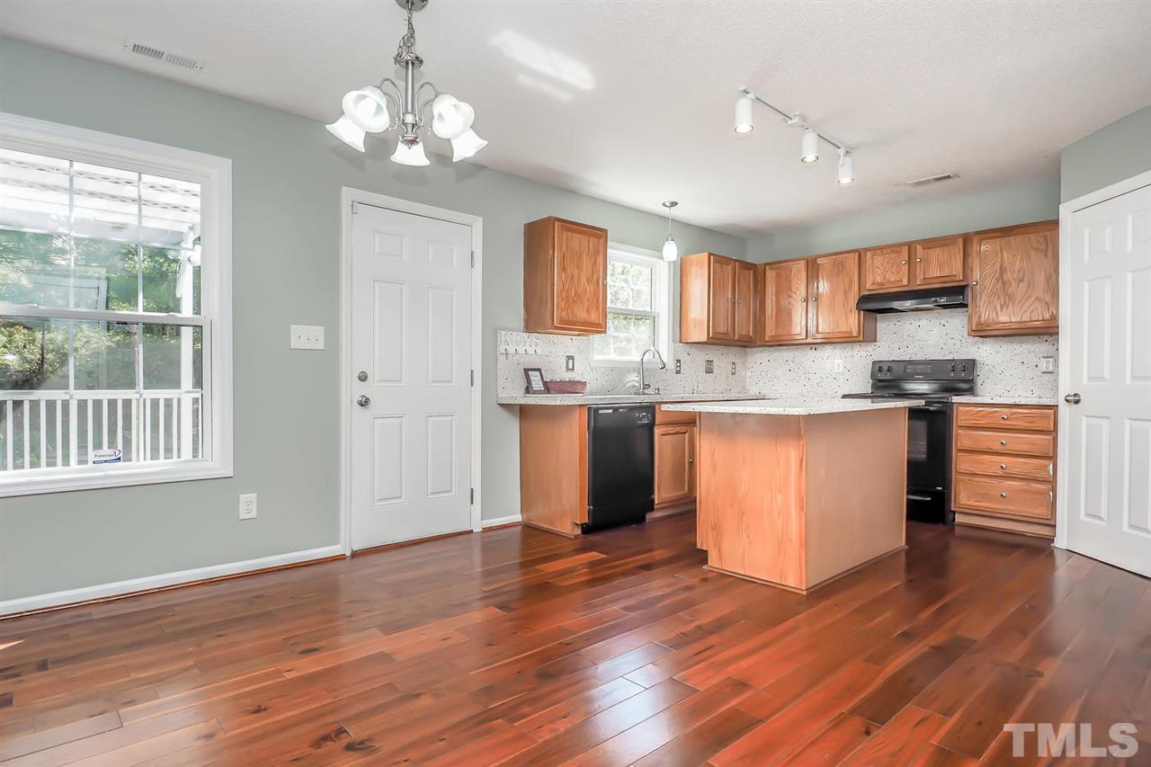 2804 Maple Ridge Drive Durham, NC 27704 - Photo 3 of 8 The open kitchen offers GRANITE counters, BLACK appliances and a WALK IN PANTRY. The large ISLAND provides tons of prep space!