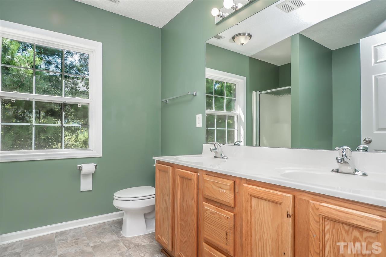 2804 Maple Ridge Drive Durham, NC 27704 - Photo 5 of 8 Master Bath has SOLID countertops, DOUBLE VANITY, separate shower and GARDEN TUB, freshly painted & NEW FLOORING.