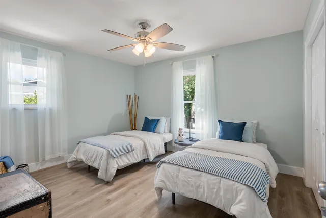 a bathroom with a double vanity sink toilet and shower