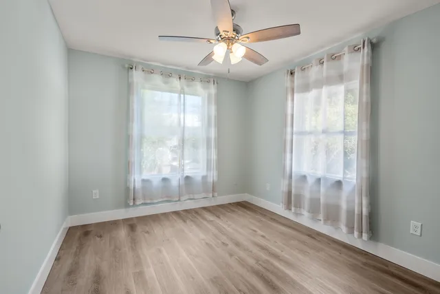 an aerial view of residential houses with city view
