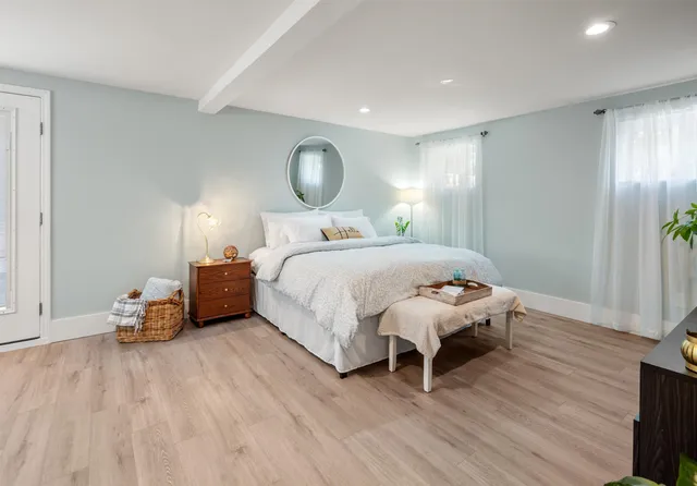 a bedroom with a bed and a dresser