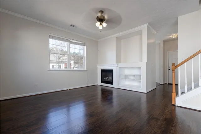 a kitchen with a stove sink and cabinets