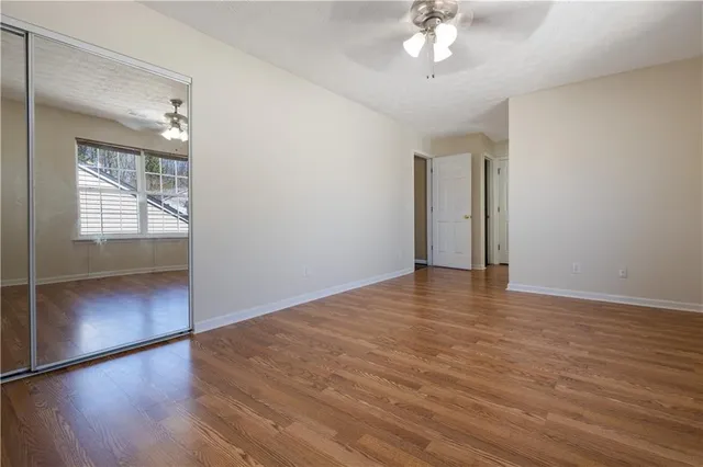 a bathroom with a sink a toilet and a window