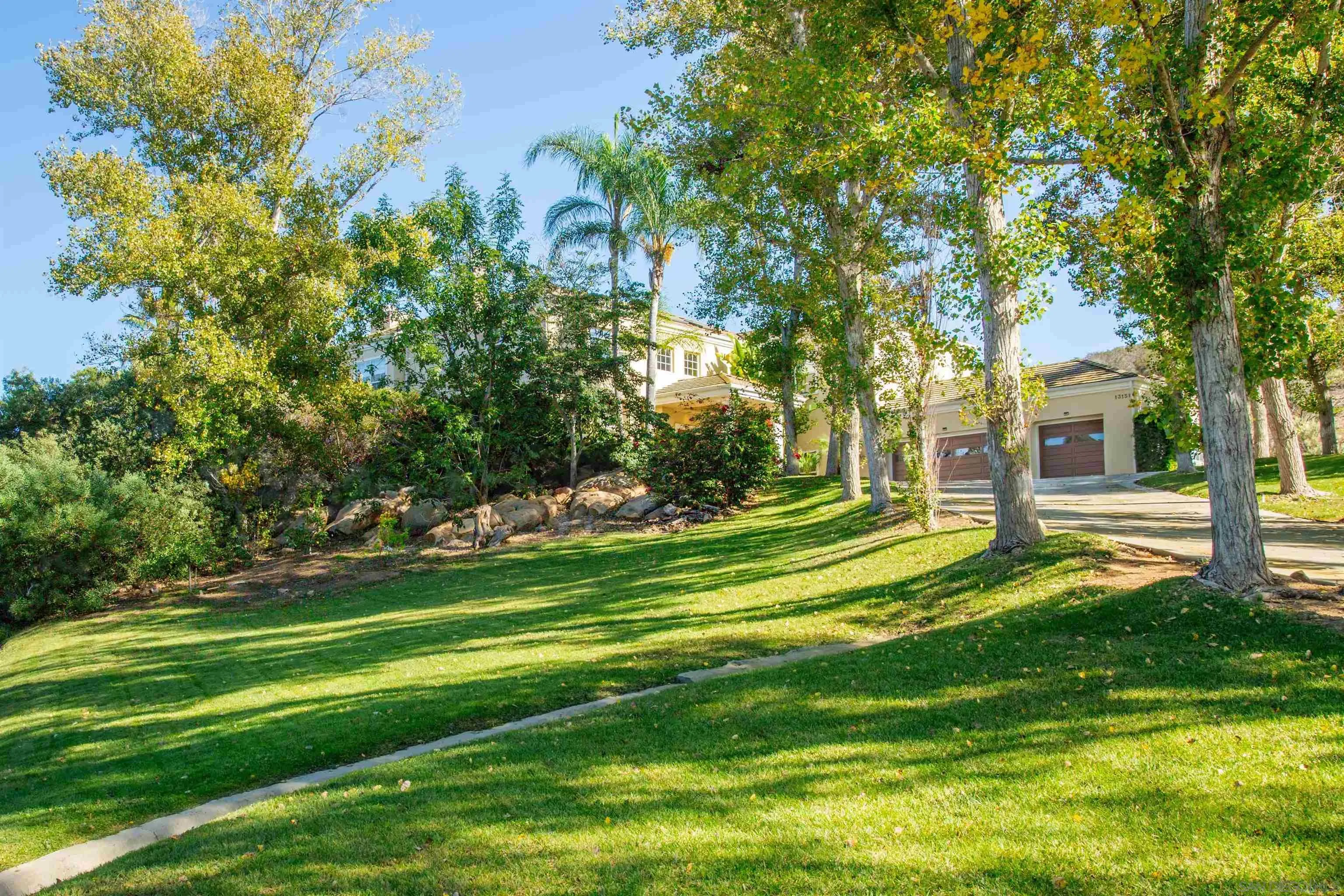 13151 Stone Canyon Road Poway, CA 92064 - Photo 36 of 52 a garden view with tall trees