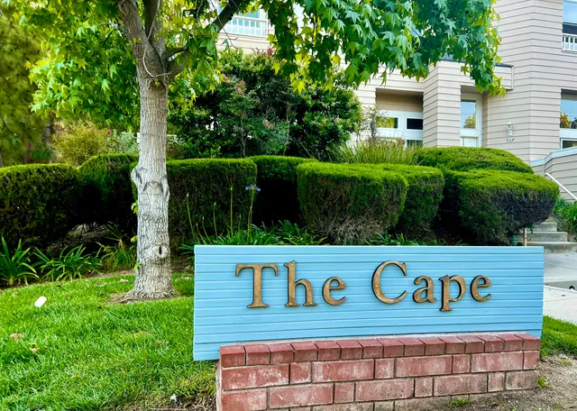 a view of sign board with a house