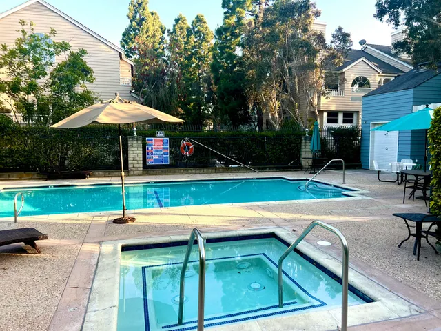 a view of a swimming pool with a patio