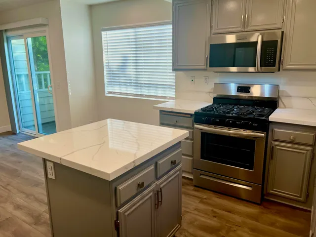 a kitchen with a stove and a microwave
