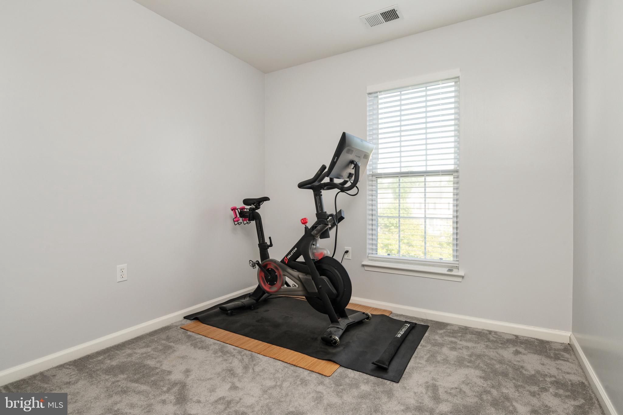 2333 Manomet Court Crofton, MD 21114 - Photo 21 of 44 a room with gym equipment and windows