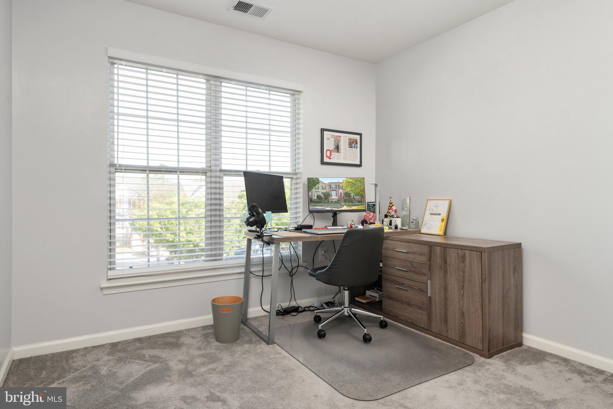 2333 Manomet Court Crofton, MD 21114 - Photo 23 of 44 a view of a workspace with furniture and a window