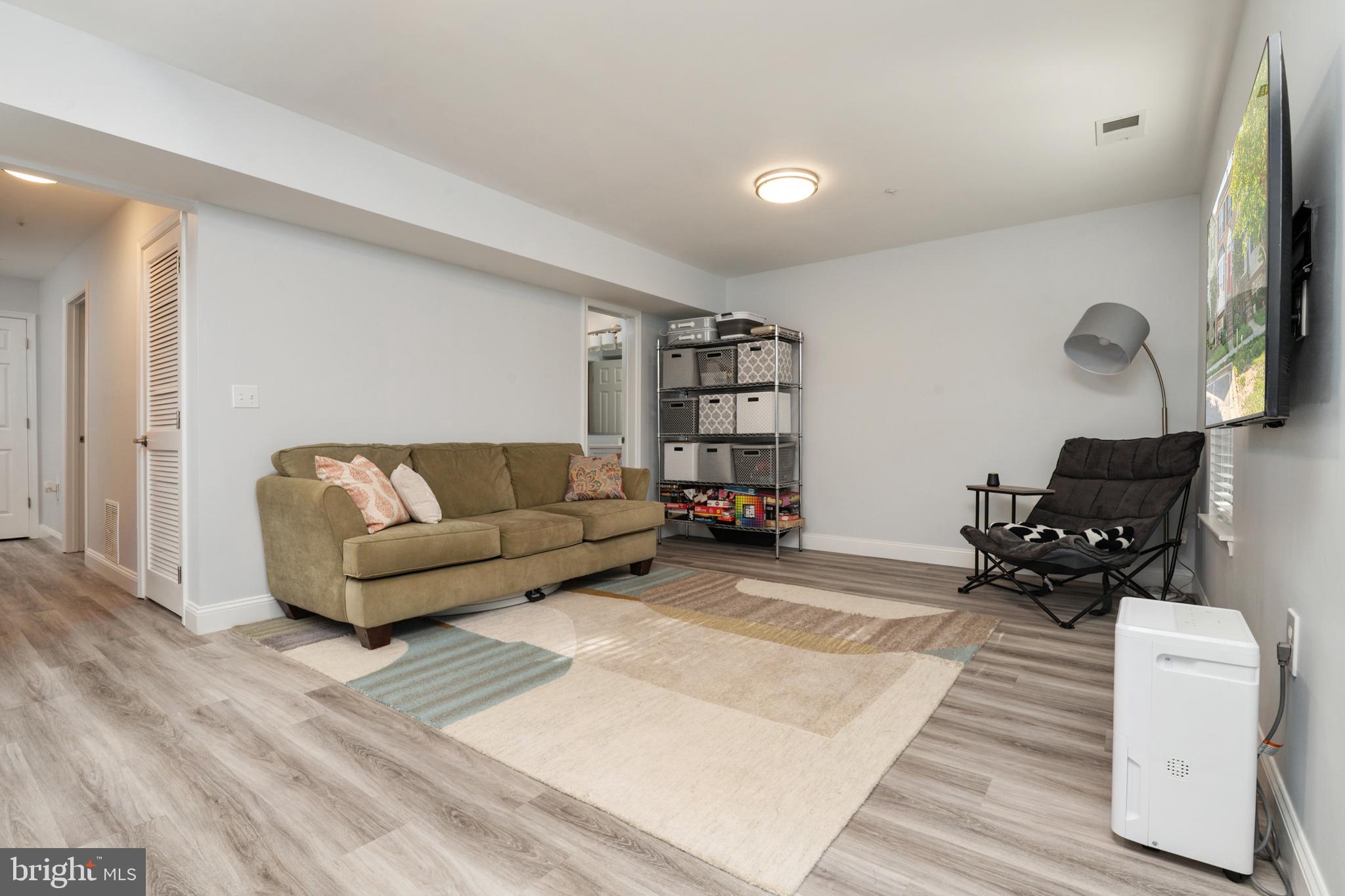 2333 Manomet Court Crofton, MD 21114 - Photo 26 of 44 a living room with furniture and a flat screen tv