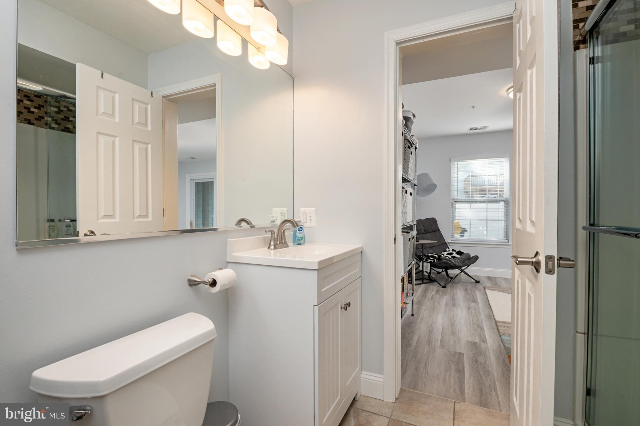 2333 Manomet Court Crofton, MD 21114 - Photo 27 of 44 a bathroom with a toilet sink and mirror