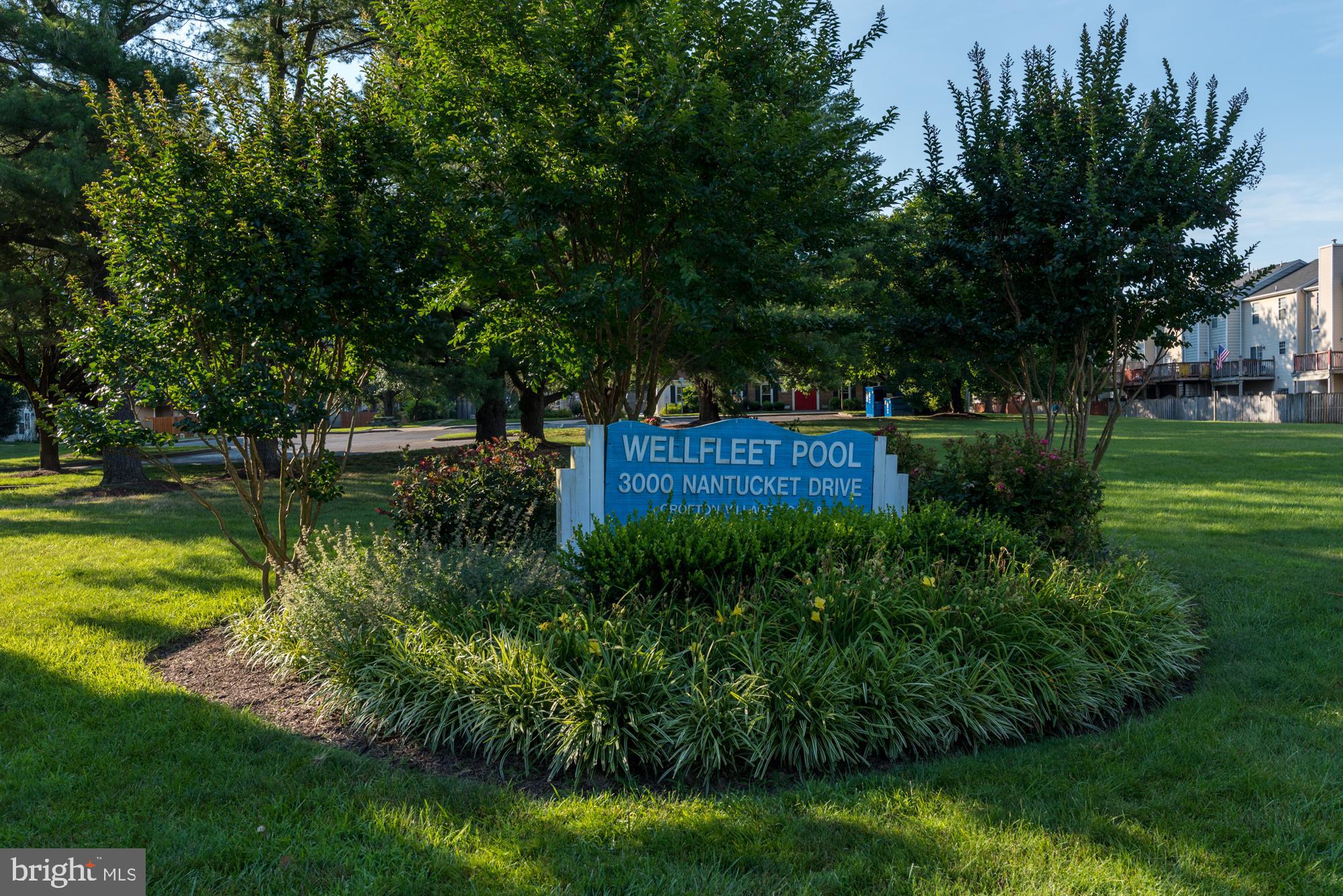 2333 Manomet Court Crofton, MD 21114 - Photo 35 of 44 a garden with trees in front of it