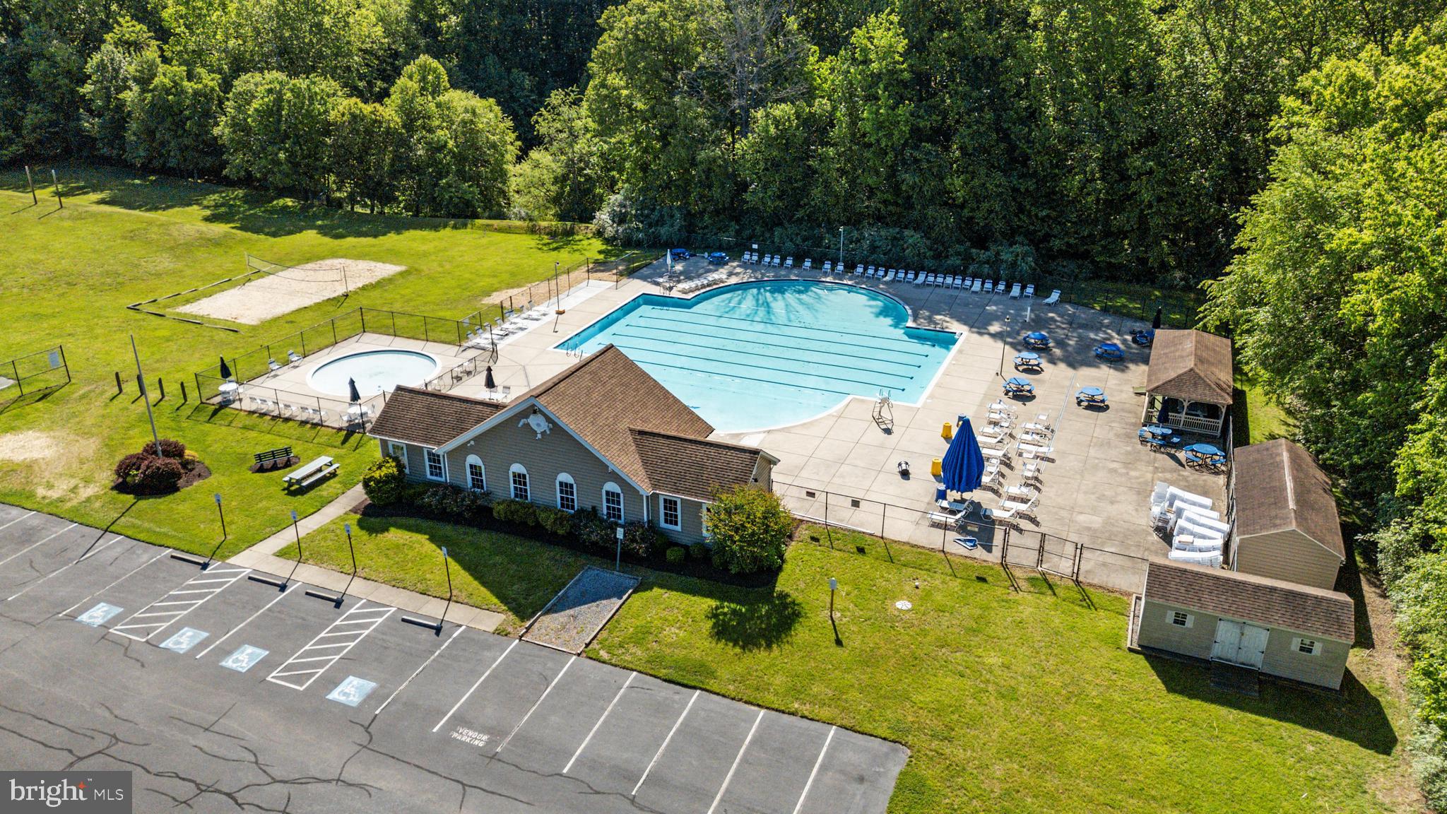 2333 Manomet Court Crofton, MD 21114 - Photo 41 of 44 an aerial view of a house with swimming pool and large trees