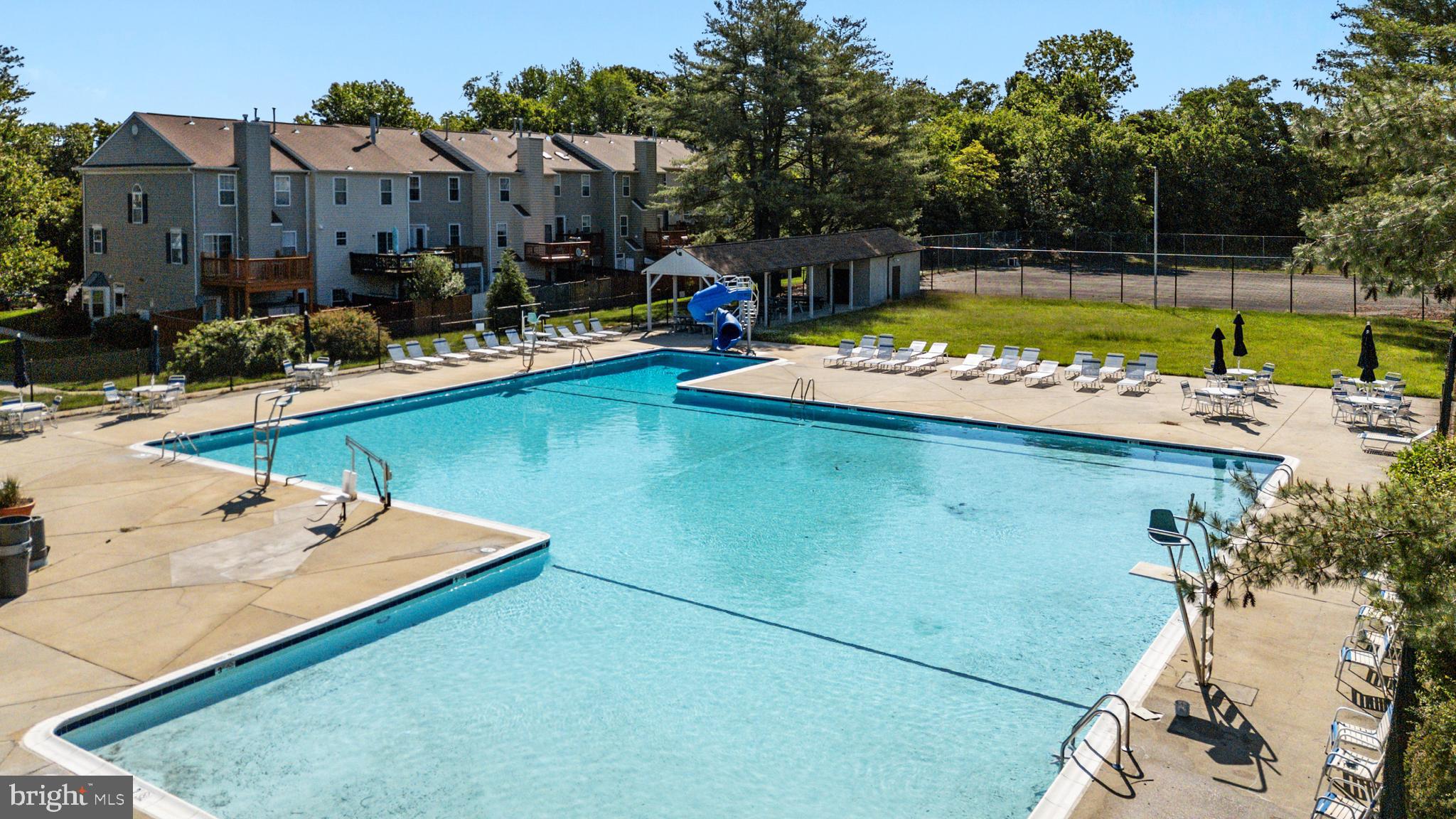 2333 Manomet Court Crofton, MD 21114 - Photo 43 of 44 a view of a swimming pool with a patio and a garden