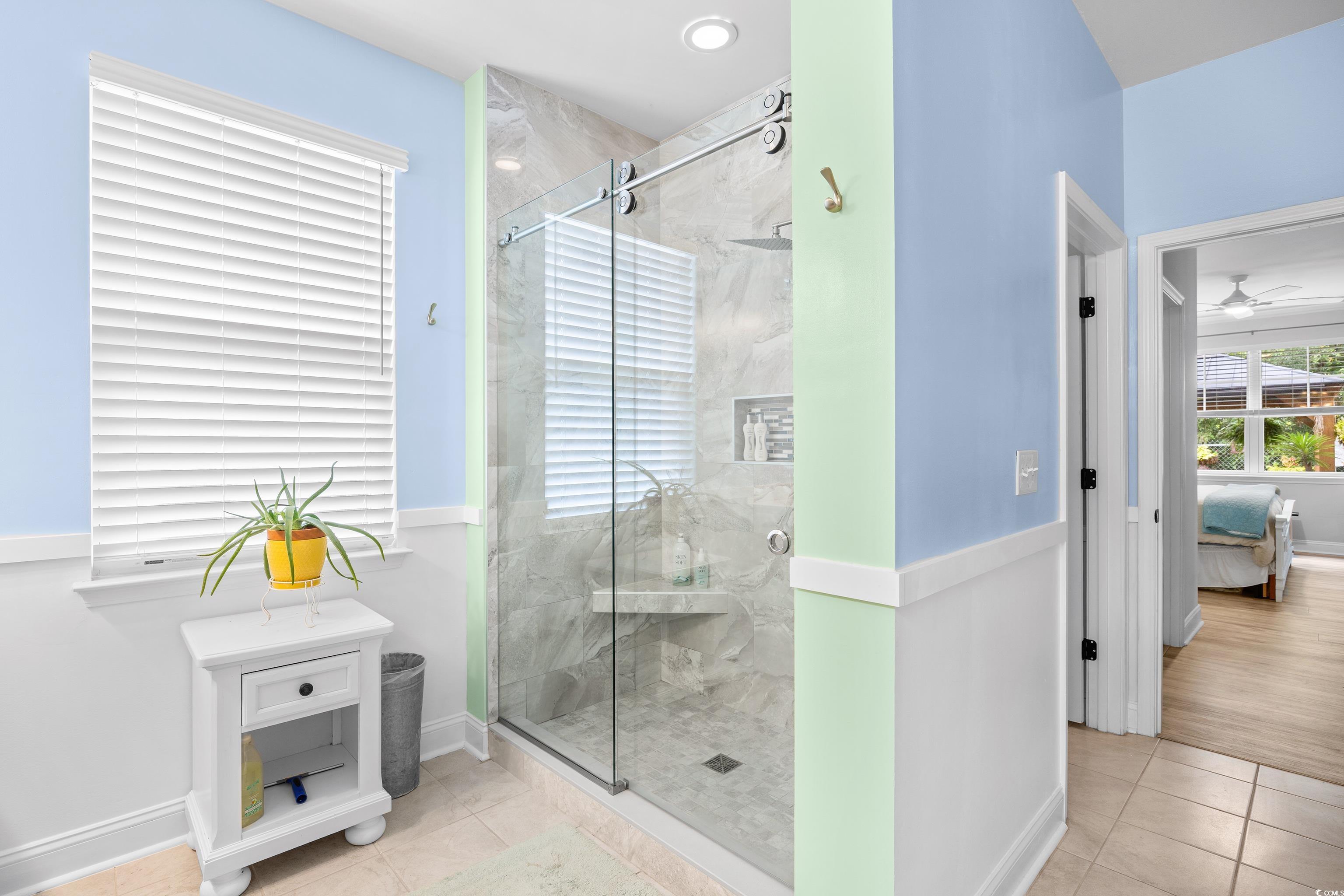 1104 Inlet View Drive North Myrtle Beach, SC 29582 - Photo 17 of 40 Bathroom with tile patterned floors, a marble finish shower, and ensuite bathroom