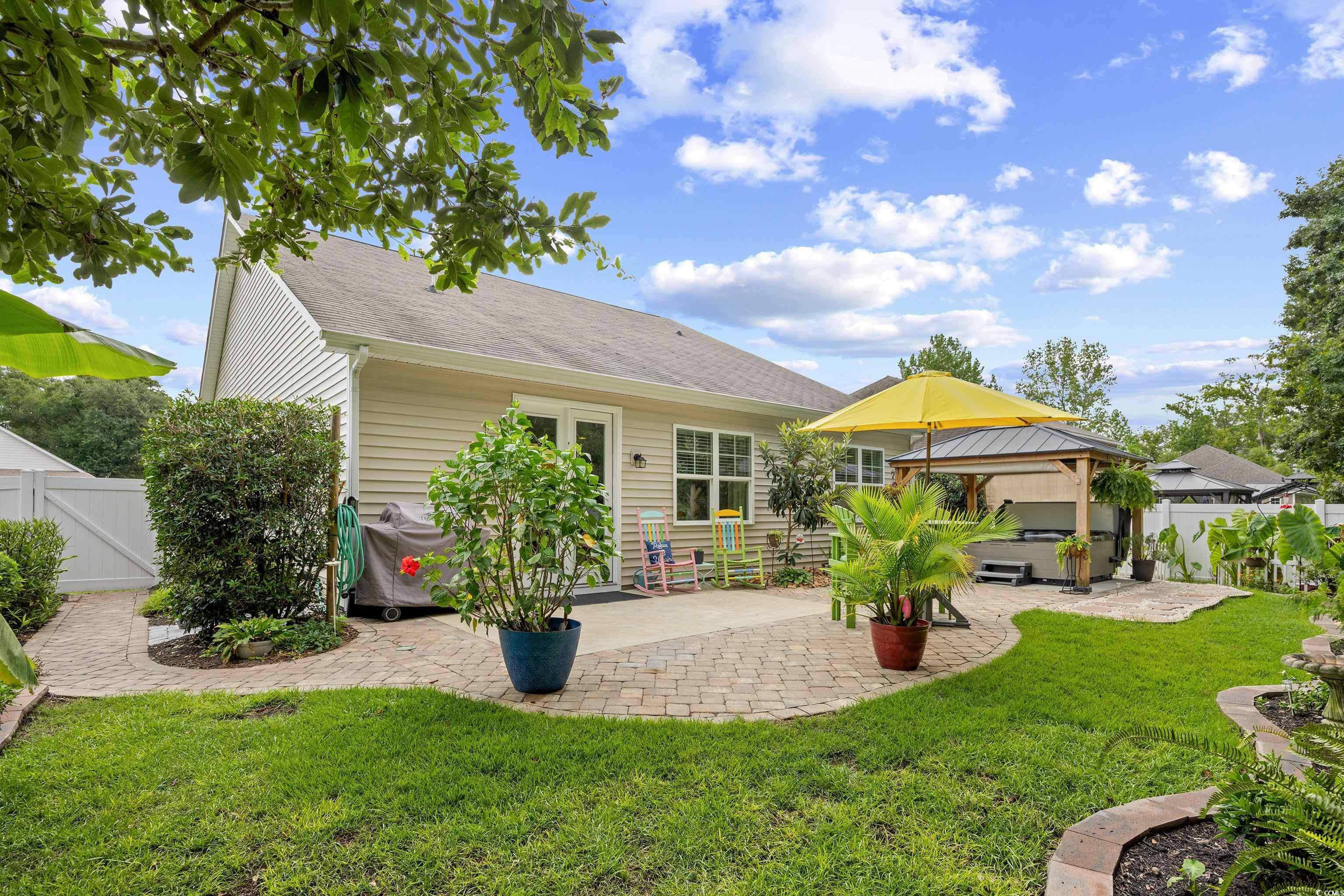 1104 Inlet View Drive North Myrtle Beach, SC 29582 - Photo 29 of 40 Rear view of house with a patio area, a gazebo, and a gate