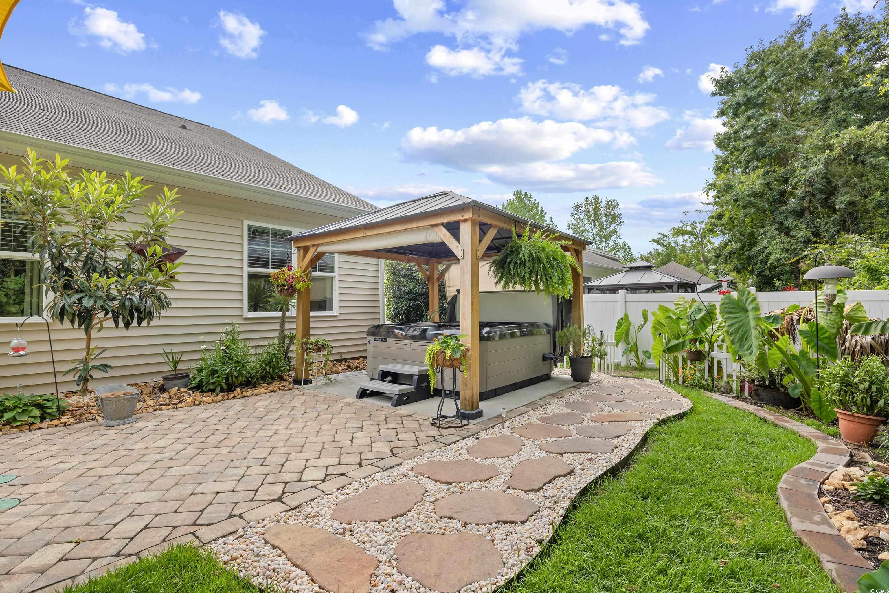 1104 Inlet View Drive North Myrtle Beach, SC 29582 - Photo 31 of 40 View of patio with a hot tub and a gazebo