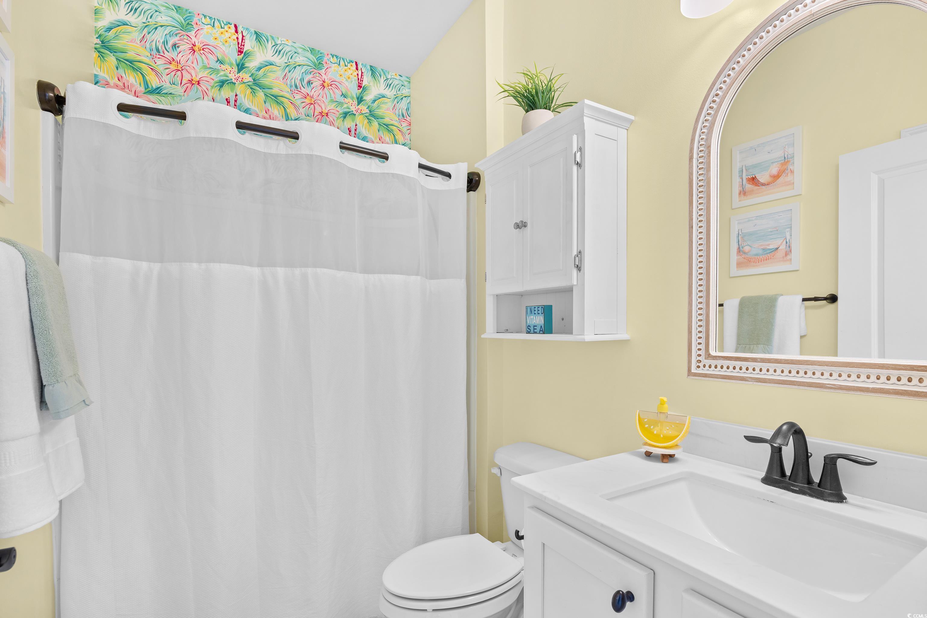 1104 Inlet View Drive North Myrtle Beach, SC 29582 - Photo 10 of 40 Bathroom featuring vanity and a shower with curtain