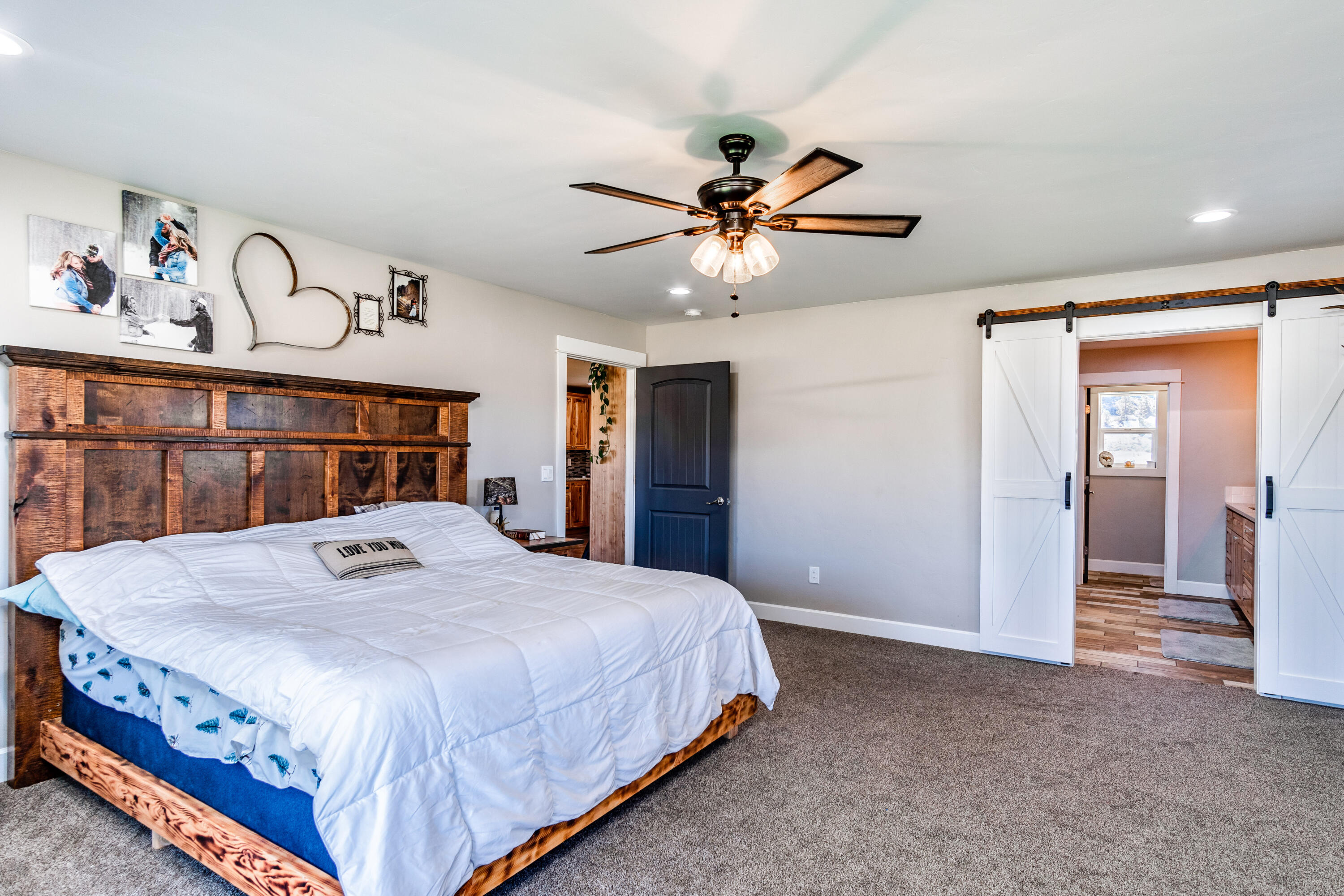 4893 Southwest Trout Road Terrebonne, OR 97760 - Photo 15 of 63 Primary bedroom - barn doors to ensuite