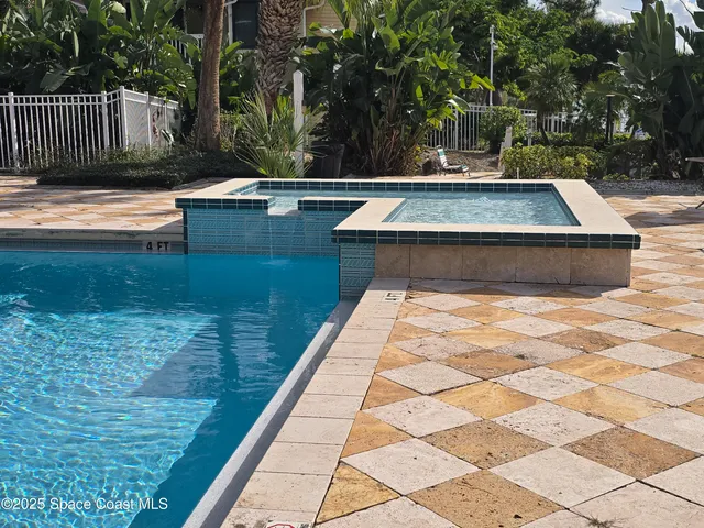 a view of swimming pool with a patio