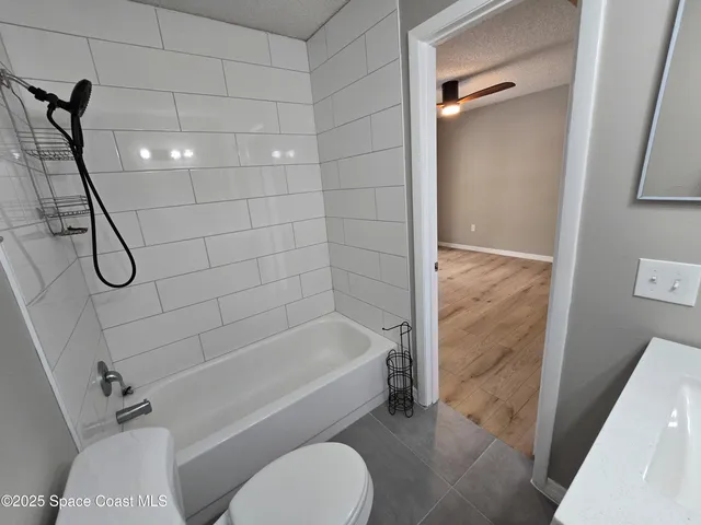 a bathroom with a toilet and shower