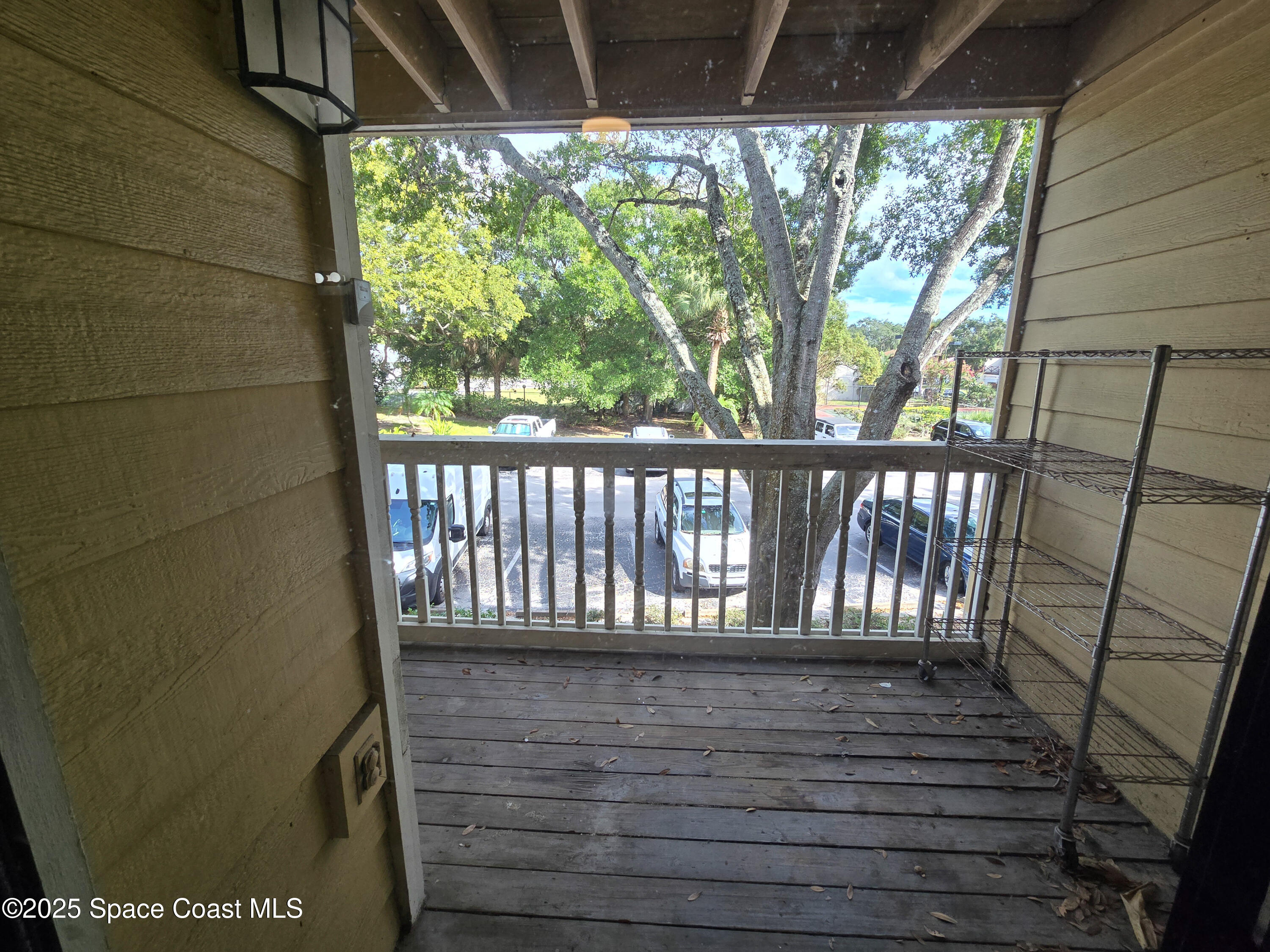 225 South Tropical Trail, Unit 217 Merritt Island, FL 32952 - Photo 9 of 18 a view of wooden balcony