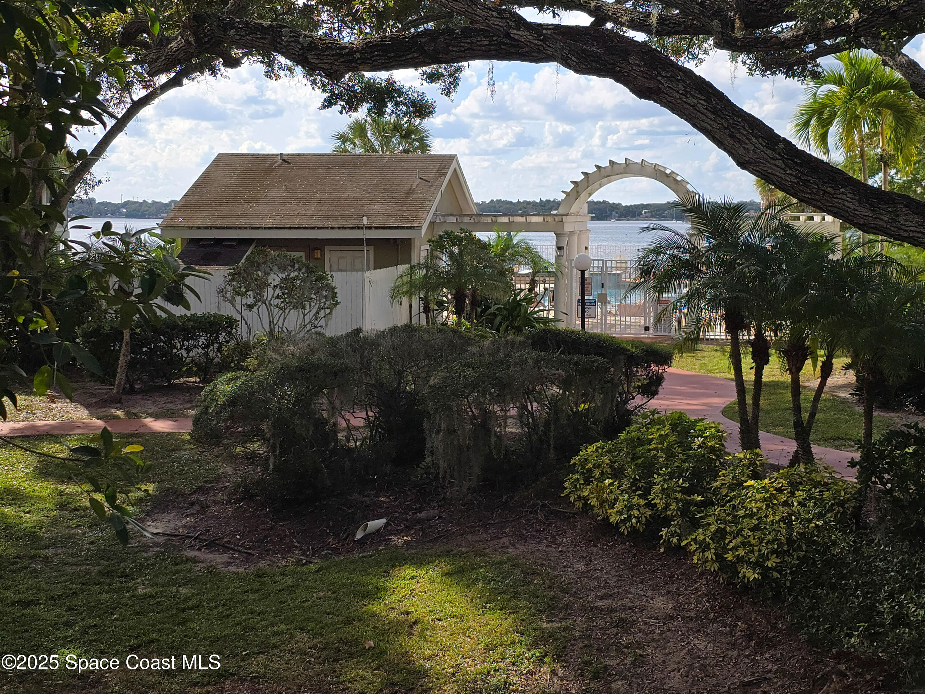 225 South Tropical Trail, Unit 217 Merritt Island, FL 32952 - Photo 10 of 18 a view of house with backyard and swimming pool