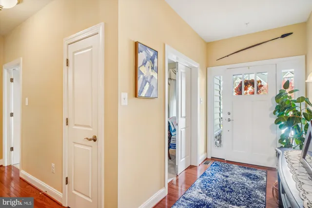 a view of an entryway with wooden floor