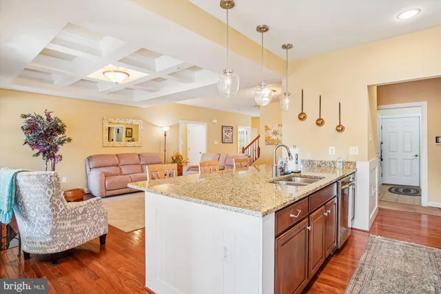 a spacious bathroom with a granite countertop sink a mirror and a shower