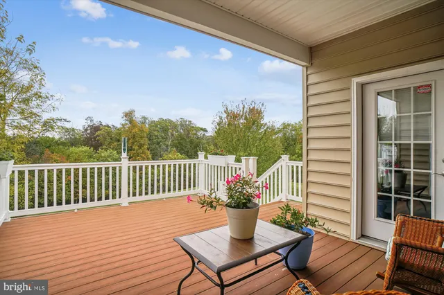 a view of a chairs and table on the deck
