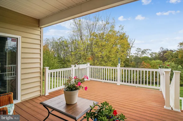 a view of a two chairs and table in the balcony
