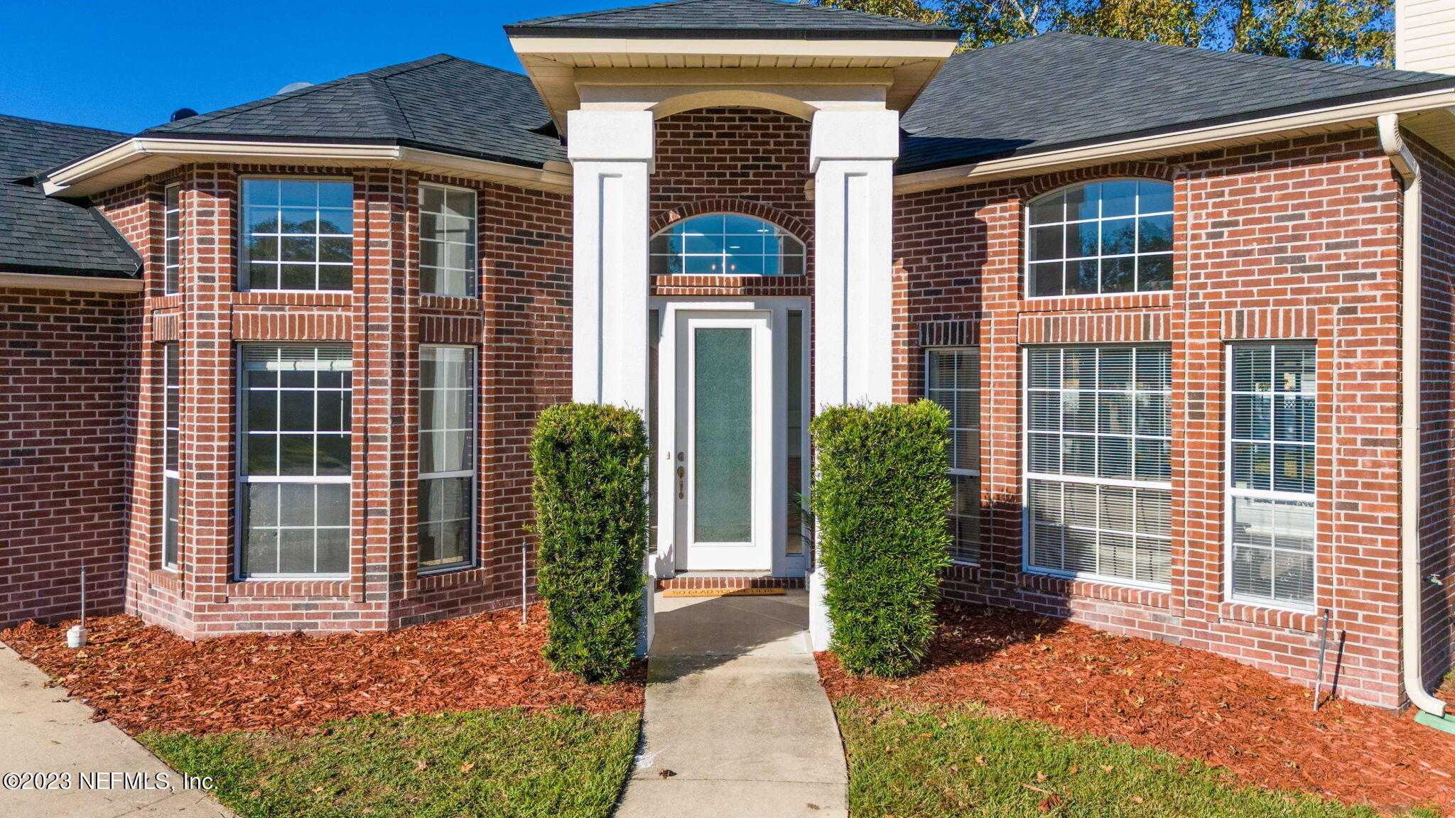 3795 Bedford Drive Middleburg, FL 32068 - Photo 2 of 54 a front view of a house with garden
