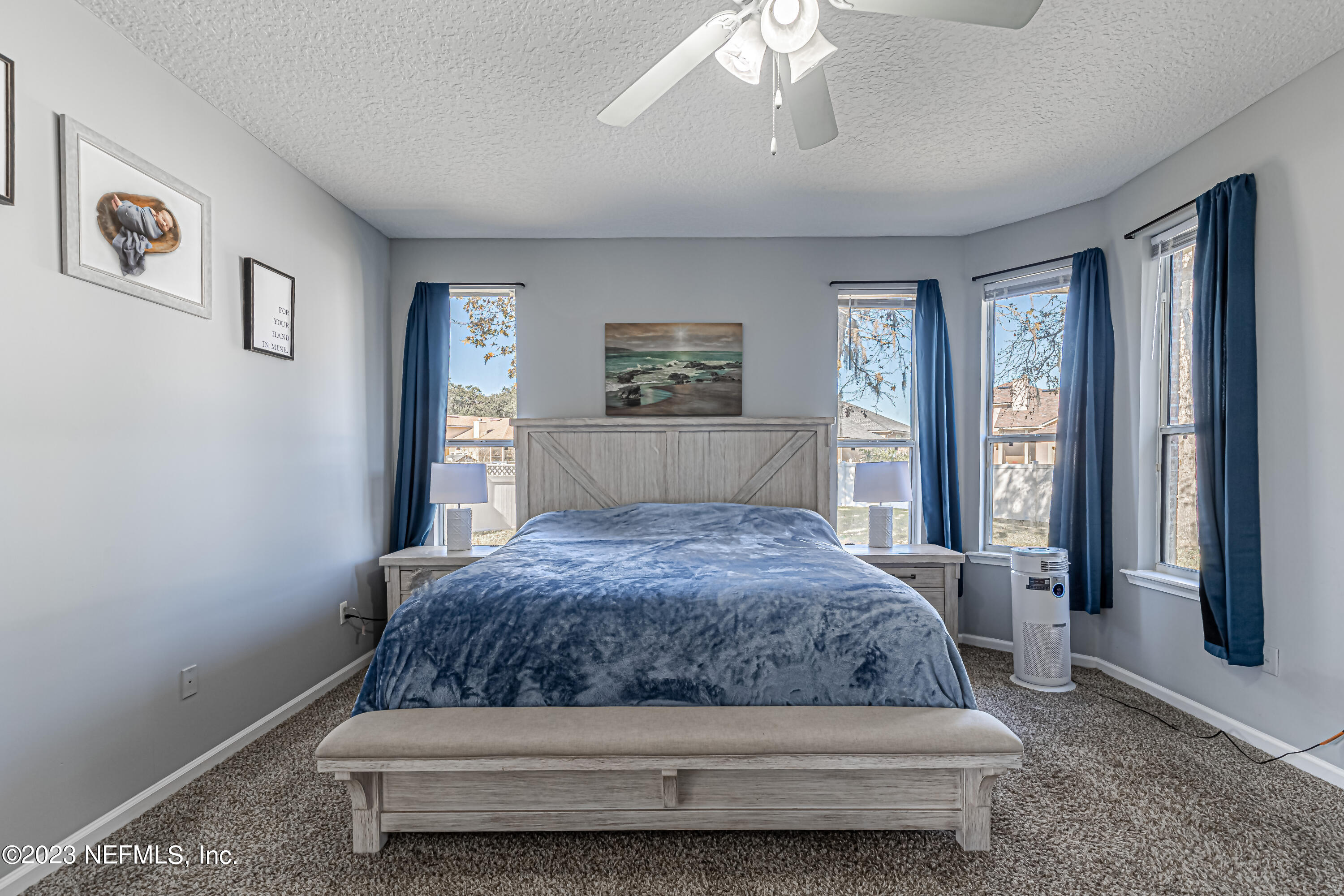 3795 Bedford Drive Middleburg, FL 32068 - Photo 26 of 54 a bedroom with a large bed and a window