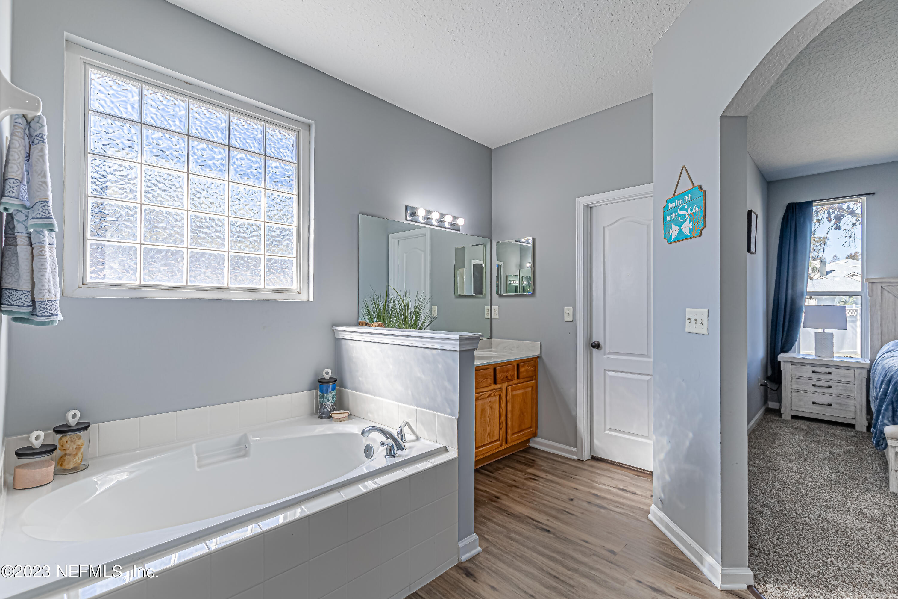 3795 Bedford Drive Middleburg, FL 32068 - Photo 34 of 54 a bathroom with a tub sink and shower