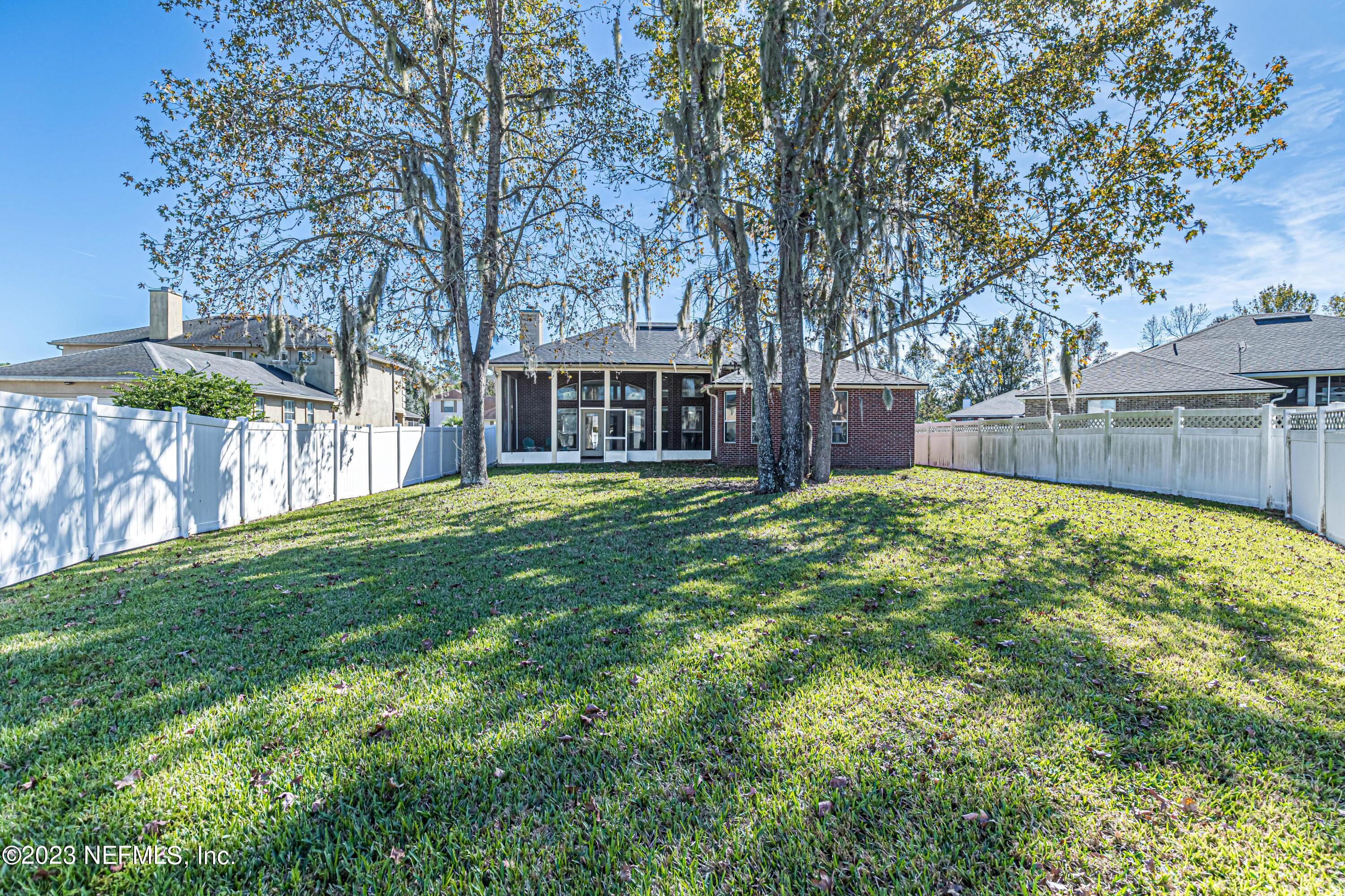 3795 Bedford Drive Middleburg, FL 32068 - Photo 39 of 54 a view of a yard with a large tree
