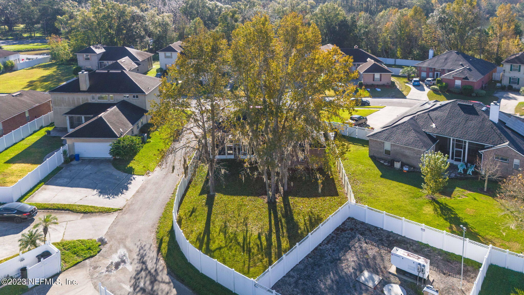 3795 Bedford Drive Middleburg, FL 32068 - Photo 44 of 54 an aerial view of a house with swimming pool and large trees