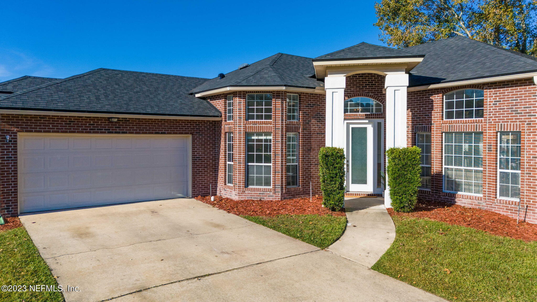 3795 Bedford Drive Middleburg, FL 32068 - Photo 49 of 54 a front view of a house with garden