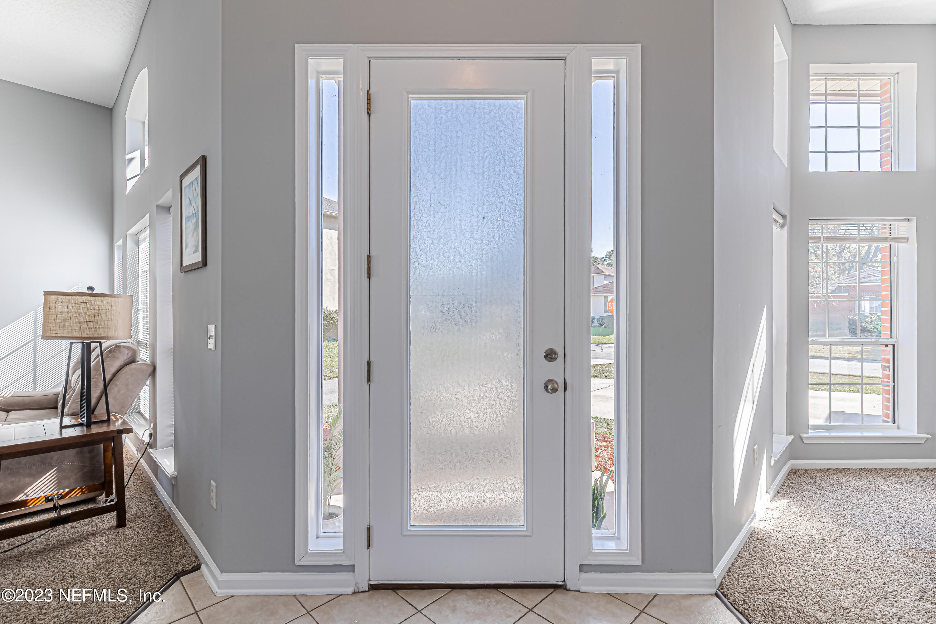 3795 Bedford Drive Middleburg, FL 32068 - Photo 5 of 54 a view of a livingroom with wooden floor and a fireplace