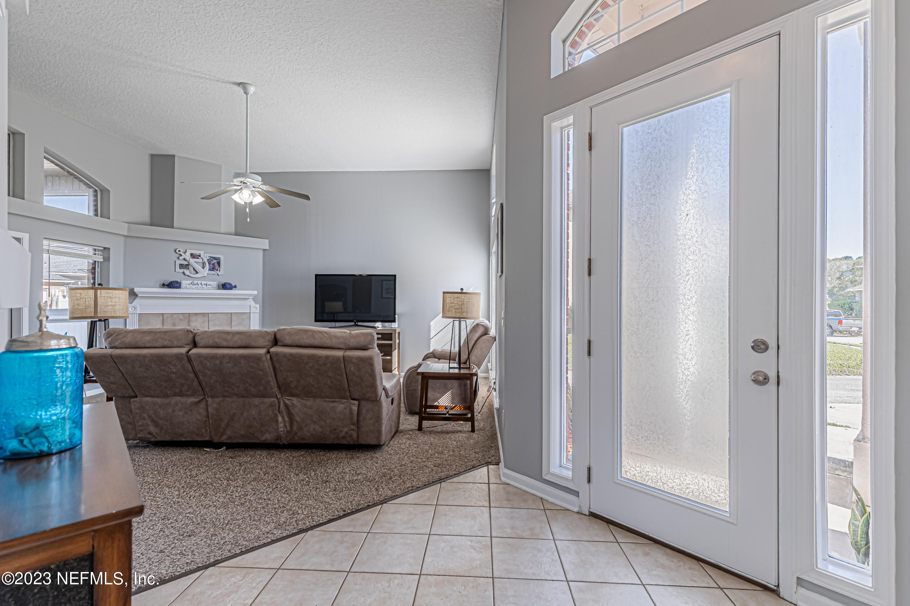 3795 Bedford Drive Middleburg, FL 32068 - Photo 6 of 54 a living room with furniture and a flat screen tv