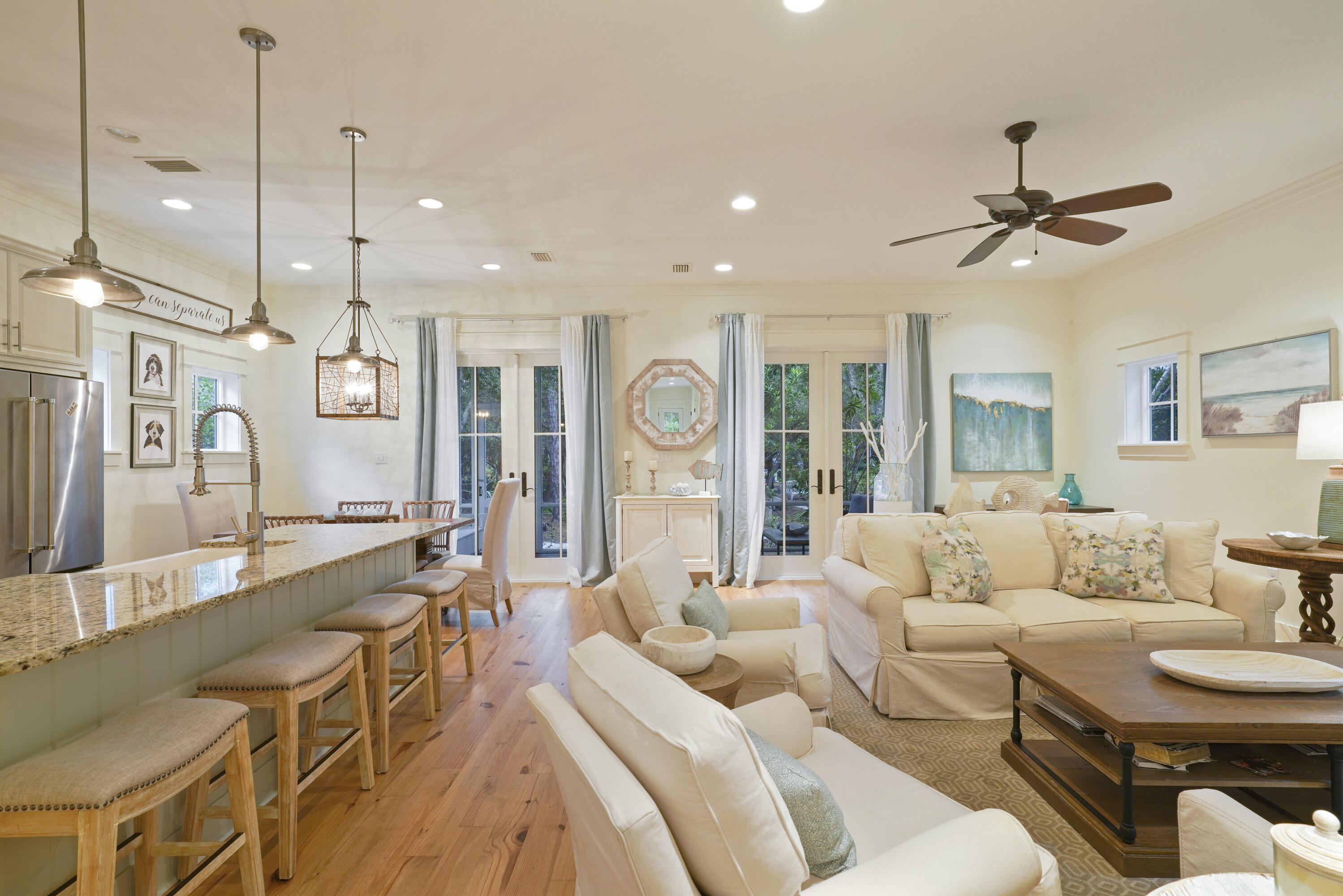 93 Anchor Rode Circle Santa Rosa Beach, FL 32459 - Photo 3 of 60 a living room with furniture a ceiling fan and a chandelier