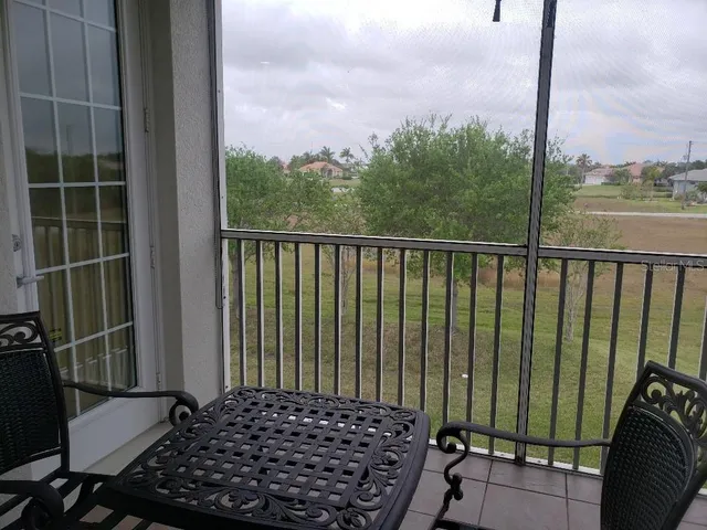 a view of balcony with furniture
