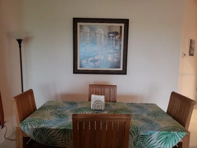 a bedroom with a bed and chair